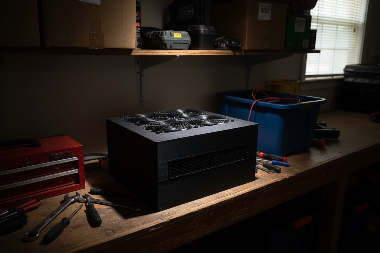 StealthMiner mining heater on a workbench in a garage